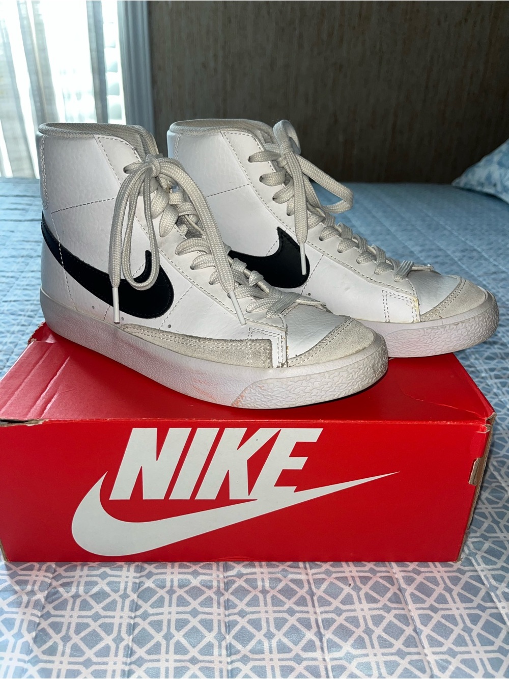Nike White High-Top Sneakers with Black Swoosh